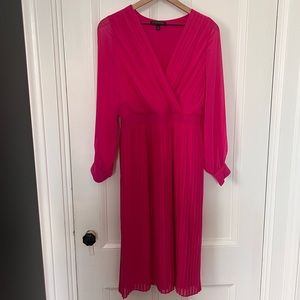 Bright pink v neck faux wrap look with pleats and sheer arms